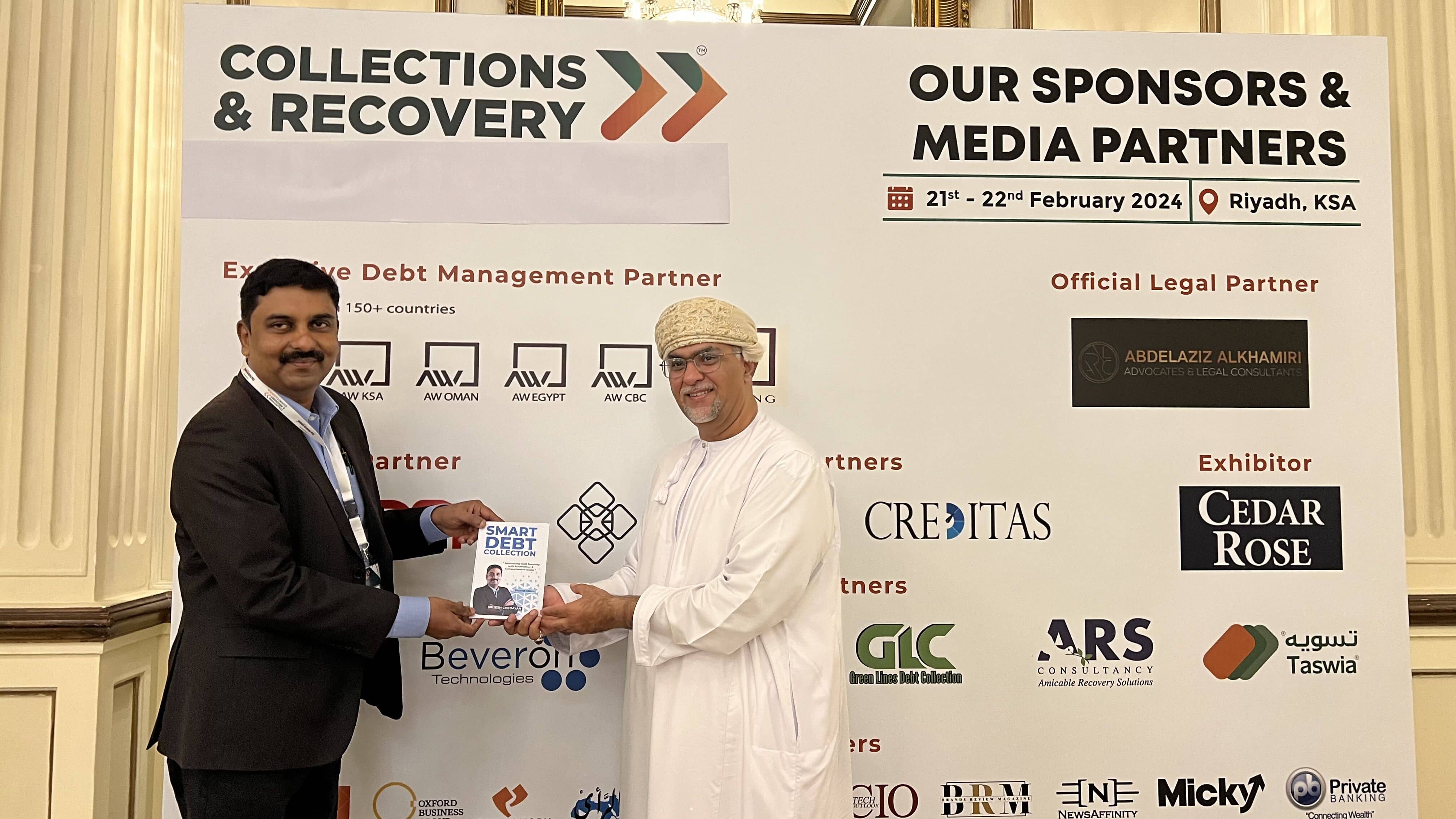 Beveron CEO Brijesh Chedayan presenting the Smart Debt Collection book at the Collections & Recovery summit in Riyadh, Kingdom of Saudi Arabia