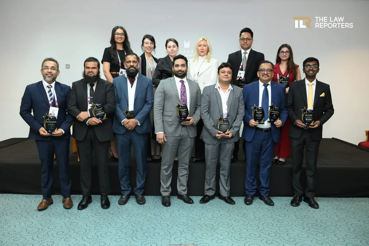 Speakers and award recipients holding their summit awards at the Bespoke Global Legal Summit Dubai